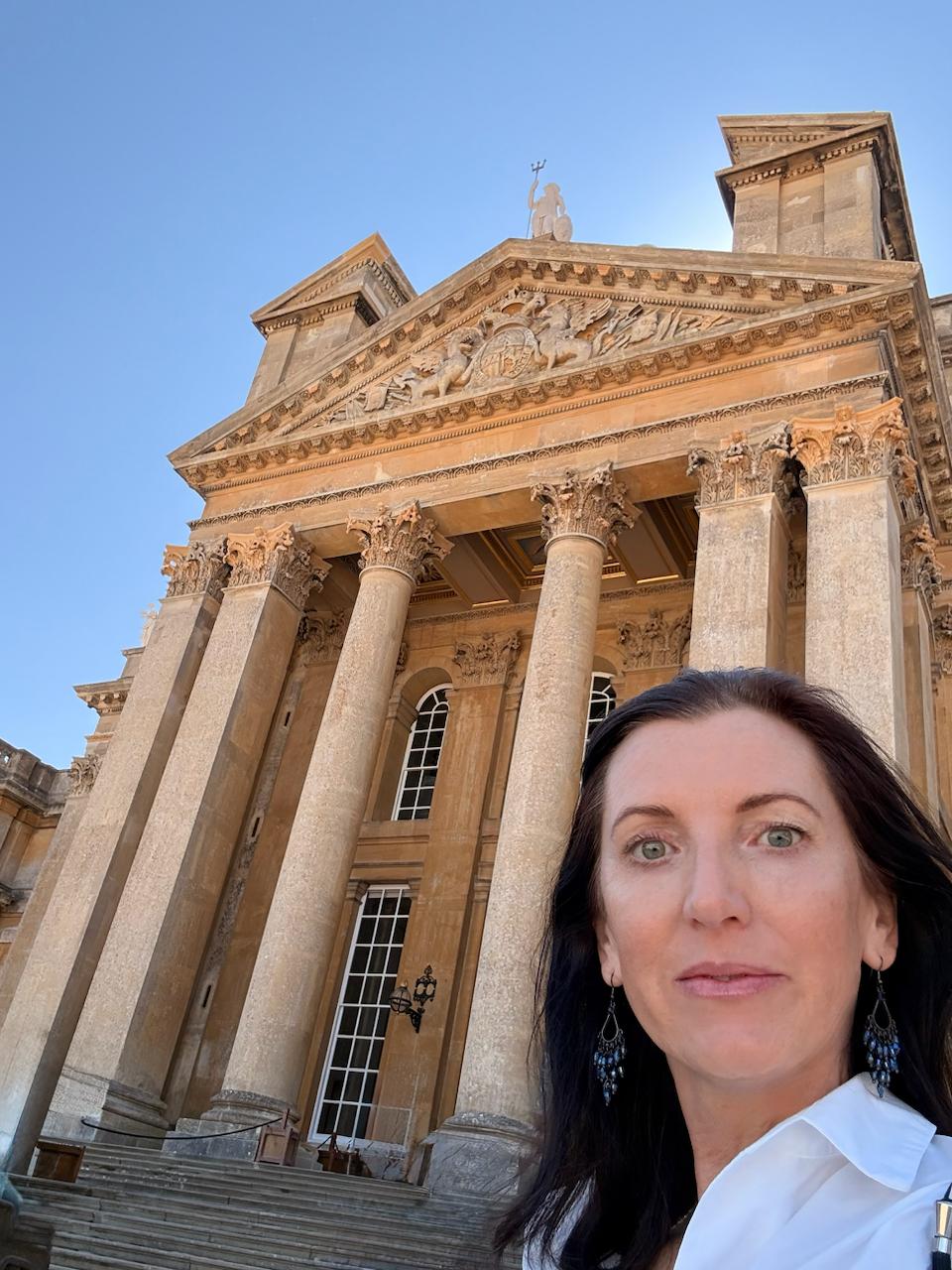 Merilyn Bullen outside a historic columned building